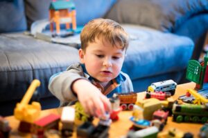 Picture of Kid Playing With Activity Toys